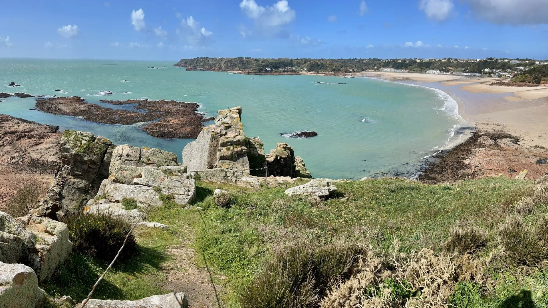 Coastal cliffs and turquoise sea on the Channel Islands at golden hour