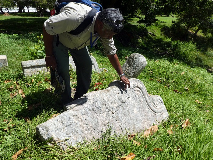 Prasantha pointing out some of the ancient relief stone carving in an otherwise deserted field