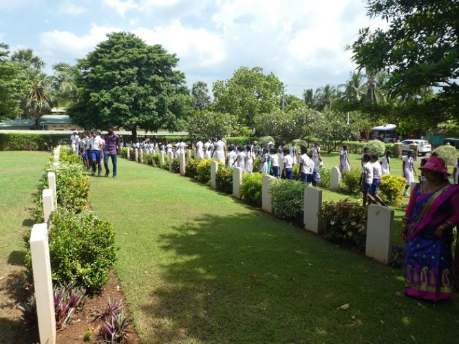 Sri Lankan school kids on a holiday field trip to pay their respects. They filed row by row through the cemetery - very interesting procession to watch.