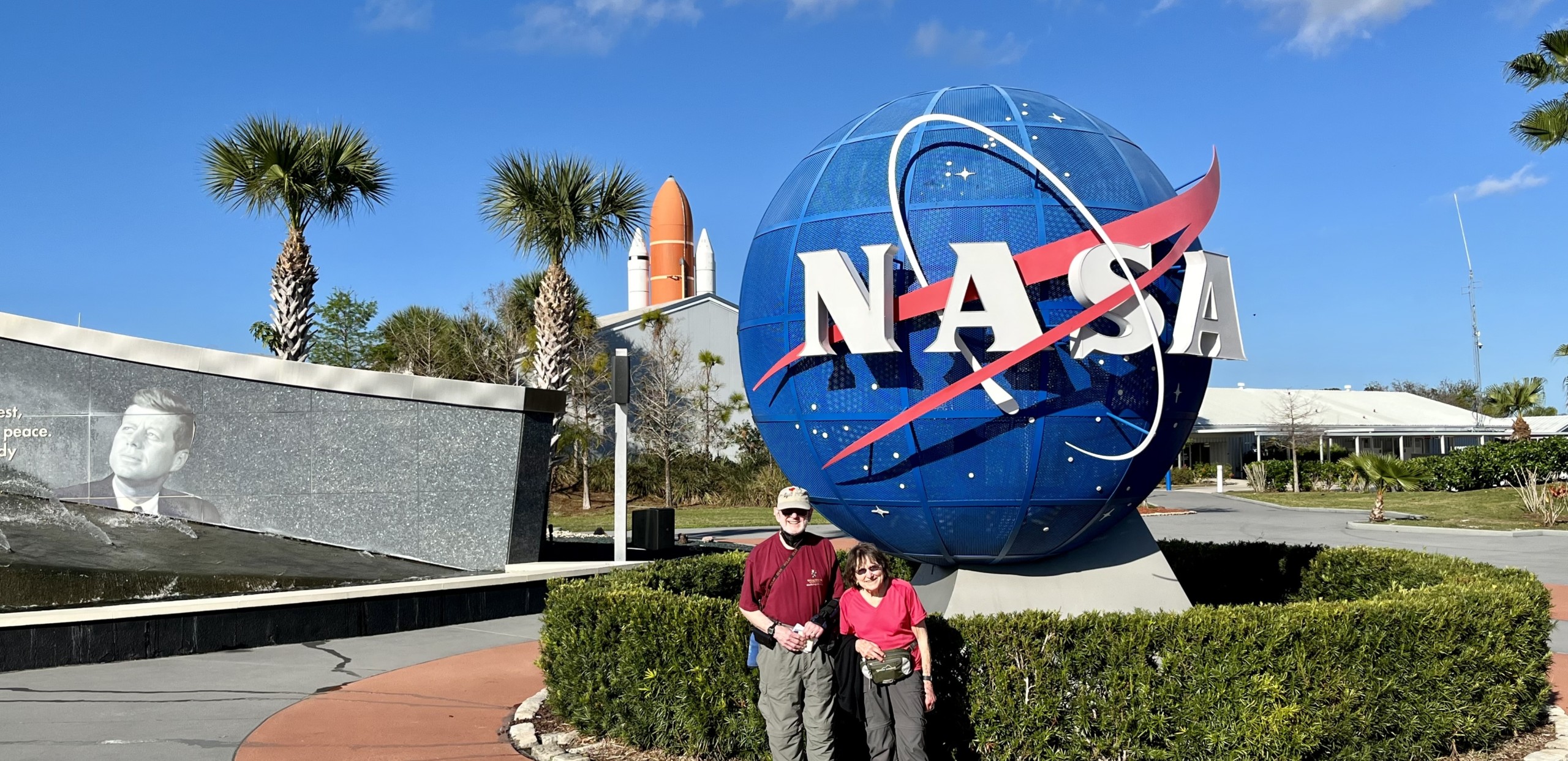 couple by NASA sign
