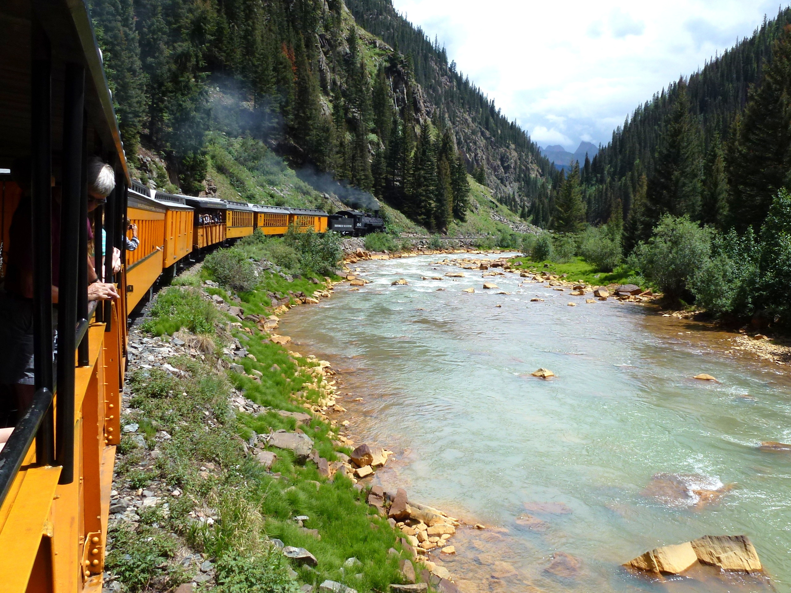 train along a river