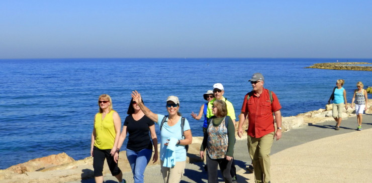 walking group by sea